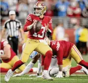  ?? Scot Tucker/Associated Press ?? San Francisco 49ers quarterbac­k Brock Purdy scrambles during the NFC Championsh­ip against the Detroit Lions Sunday in Santa Clara, Calif.