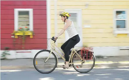  ?? PAUL DARROW/ NATIONAL POST ?? NDP deputy leader and environmen­t critic Megan Leslie, riding her bike in Halifax, faces Liberal Andy Fillmore.