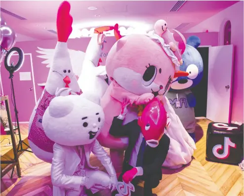  ?? SHIHO FUKADA / BLOOMBERG FILES ?? Various Tiktok users with animal costumes at Tiktok Creator’s Lab 2019. Tiktok is a media app for creating and
sharing short videos owned by Chinese company Bytedance and has gained popularity with teens worldwide.