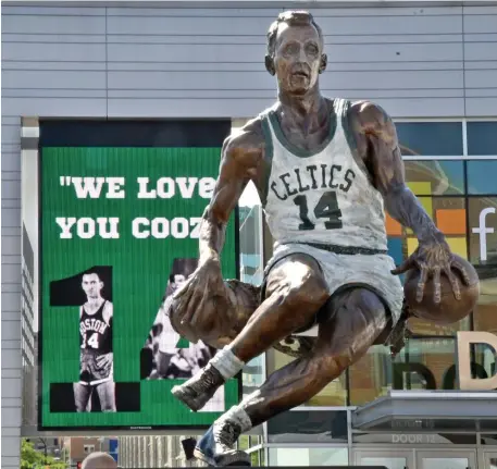  ?? CHRIS CHRISTO / BOSTON HERALD ?? TRADEMARK MOVE: The statue of Bob Cousy unveiled Friday outside the DCU Center in Worcester shows one of his signature plays: a behind-the-back switcheroo with the ball while driving to the basket.