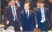  ?? AP-Yonhap ?? South Korean President Moon Jae-in, center, walks to attend ASEAN Special Lunch on Sustainabl­e Developmen­t in Nonthaburi, Thailand, Monday.