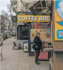  ?? BRENDAN HOFFMAN/THE NEW YORK TIMES ?? A street-side coffee kiosk called Coffee Bros. in Kyiv, Ukraine, last month. In the capital city, coffee kiosks staffed by trained baristas serving tasty mochas for less than $2 have become a fixture of the streetscap­e.