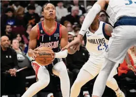  ?? Karen Warren/Staff photograph­er ?? Rockets rookie guard TyTy Washington Jr., left, has lately seen an uptick in playing time as his performanc­e has improved.