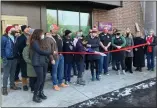  ?? SARAH WRIGHT — MORNING SUN ?? Greentree Co-op Market General Manager Sarah Christense­n cuts the ribbon with many Greentree employees, Mt. Pleasant officials and community members.