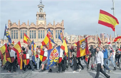  ?? EPA ?? Right-wing radicals march towards the San Jordi Square during a rally in support of Spain’s unity in Barcelona on Thursday.