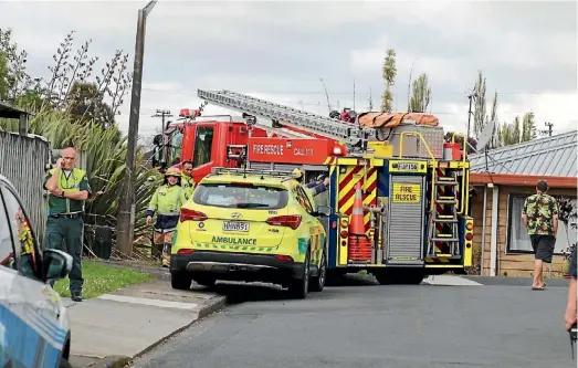  ??  ?? Emergency services at the scene of the crash in west Auckland.