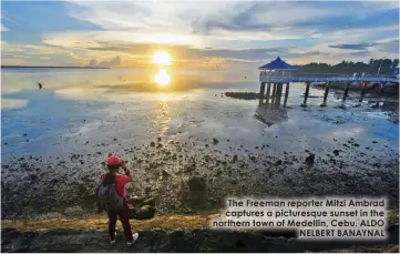  ??  ?? The Freeman reporter Mitzi Ambrad captures a picturesqu­e sunset in the northern town of Medellin, Cebu. ALDONELBER­T BANAYNAL