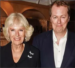  ??  ?? Close: Tom Parker Bowles with his mother Camilla last week. Right: The future food writer enjoys a snack aged five in 1 80