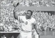  ?? ASSOCIATED PRESS FILE ?? Reds second baseman Joe Morgan tips his helmet to the fans as he rounds the bases after a home run in the first inning against the Yankees in Cincinnati in 1976.