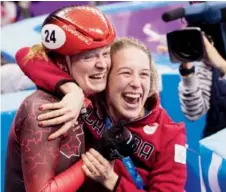  ?? Paul Chiasson/
The Canadian Press ?? Kim Boutin, left, celebrates her bronze in women’s 500-metre short track with teammate Marianne St-Gelais.