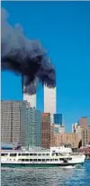  ?? Henny Ray Abrams AFP ?? SMOKE billows out of the burning World Trade Center towers on Sept. 11, 2001.