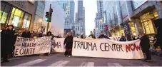  ??  ?? SUN- TIMES FILE PHOTO Community activists, shown on Michigan Avenue in 2016, spent years pressuring the University of Chicago to build an adult trauma center for the South Side. The new center opened Tuesday.