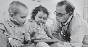 ?? PROVIDED ?? Dr. Robert Frenck, director of the Center for Vaccine Research at Cincinnati Children’s Hospital Medical Center joins William, 3, and Lillian, 4, after the children get their injections for a blinded, placebo-controlled clinical trial for the Pfizer COVID-19 vaccine in June.