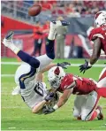  ?? RICK SCUTERI/AP ?? Cardinals defensive back A.J. Howard (right) commits a personal foul vs. the Chargers’ Sean Culkin on Aug. 11.