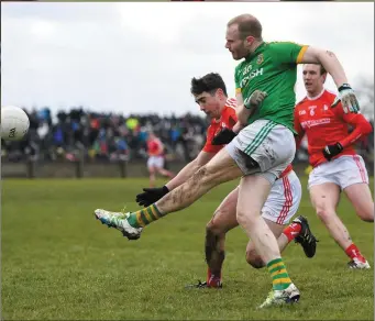  ??  ?? Sean Tobin of Meath in action against Emmet Carolan of Louth