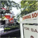  ?? David Zalubowski ?? The Associated Press file A sale sign stands in August outside a house in Denver. The National Associatio­n of Realtors reported Friday that home sales slumped again.
