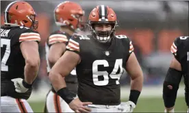  ?? DAVID RICHARD - THE ASSOCIATED PRESS ?? FILE - In this Sunday, Nov. 22, 2020 file photo, Cleveland Browns center JC Tretter stands on the field during an NFL football game against the Philadelph­ia Eagles in Cleveland. NFL players were locked out of team headquarte­rs last offseason because of the coronaviru­s pandemic. This year, their union wants them to boycott any in-person OTAs. Last year, teams were forced to do everything online until training camps opened in August, and NFL Players Associatio­n president J.C. Tretter has been advocating for a repeat of last year’s offseason, arguing that the adjustment­s caused by the coronaviru­s showed the arduous offseason programs were unnecessar­y.