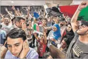  ??  ?? Migrants demand to be let on trains to Germany in the transit area designated for them at Keleti railway station in Budapest, Hungary.