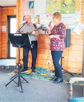  ?? Photo/ Supplied ?? The Christmas competitio­n table.
Jo Jones and Lindsay Berquist singing Christmas carols.