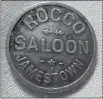  ?? Ebay listing photo (above); courtesy photo /
Tuolumne County Historical Society (right) ?? John Rocca’s saloon, pictured at right in 1897, was located where Rocca Park is today in downtown Jamestown. A drink token from the saloon (above). Drink tokens were used to ensure patrons returned another day for another drink, and maybe a few more.