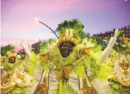  ?? Andre Penner / Associated Press ?? A dancer from the Tom Maior samba school performs during a Carnival parade in Sao Paulo.