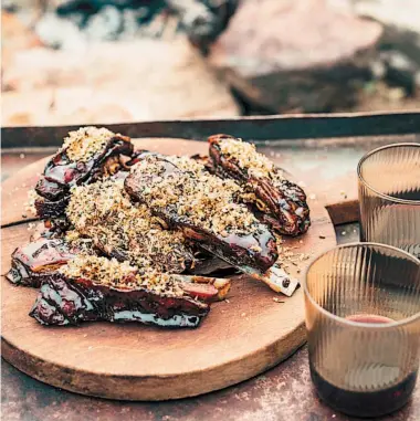  ??  ?? Lamb ribs from Analiese Gregory's recipe book. Photo: Adam Gibson/PA