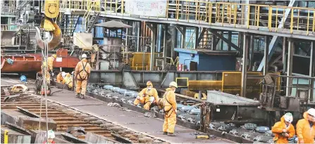  ?? Courtesy of POSCO ?? Workers clean up the No. 2 hot strip plant of POSCO’s main steel mill in Pohang, North Gyeongsang Province, Wednesday.