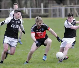  ??  ?? Action shot from Drumcliffe/Rosses Point’s win over Tubbercurr­y. Photo: Carl Brennan.