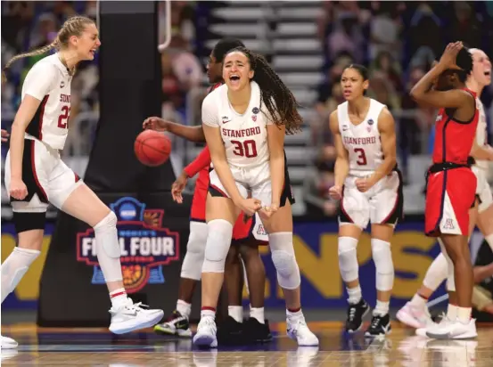  ?? GETTY IMAGES ?? Haley Jones (30) and her teammates celebrate Stanford’s victory against Arizona in the NCAA women’s championsh­ip game Sunday in San Antonio.