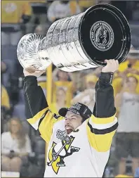  ?? AP PHOTO ?? Sidney Crosby celebrates the Pittsburgh Penguins’ Stanley Cup victory Sunday night in Nashville. The Cole Harbour native was also named playoff MVP.