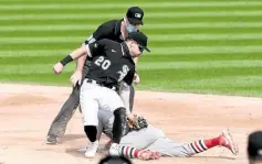  ?? —PHOTOS FROM AP ?? SAFE St. Louis’ Harrison Bader beats Chicago’s Danny Mendick’s tag at second.