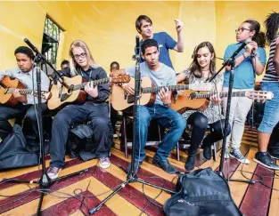  ?? ?? Guitars Over Guns, an organizati­on that links students from vulnerable communitie­s to profession­al musical mentors and teaches them self-confidence, artistic skills and resilience, is one of 25 Miami nonprofits that will receive a CreARTE grant from the Jorge M. Pérez Family Foundation.
