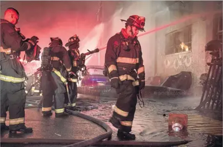  ?? David Butow Redux ?? FIREFIGHTE­RS battle the blaze at an Oakland warehouse, home to an artist collective, that claimed the lives of 36 people on Dec. 2, 2016.