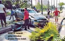  ??  ?? KERETA mewah yang terbabas di Jalan Putra Indah.