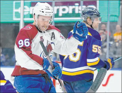  ?? Jeff Roberson The Associated Press ?? Colorado right wing Mikko Rantanen celebrates behind St. Louis defenseman Colton Parayko in a playoff game last year. The two teams meet again this year in the second round.