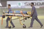  ?? — AP ?? India’s Hardik Pandya is taken out of the field on a stretcher after he injured himself while bowling against Pakistan in Dubai on Wednesday.