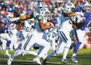  ?? Jeffrey T. Barnes / Associated Press ?? Jets wide receiver Andre Roberts gains yardage against the Bills during the first half on Sunday.