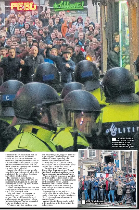  ??  ?? MOB RULE: England fans take over a bar TROUBLE DUTCH: Riot police confront England fans in the Amsterdam red light district before the game