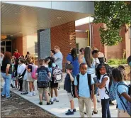  ?? MEDIANEWS GROUP FILE PHOTO ?? Students arrive for the first day of classes at Barth Elementary School in this 2013file photo. Many Barth students were on their way to school when a man was shot and killed just two blocks away in the Bright Hope community.