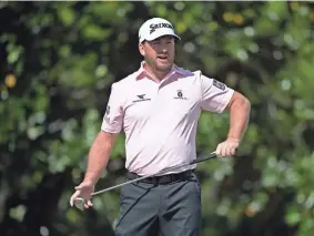  ?? Fla. PHELAN M. EBENHACK/AP ?? Graeme McDowell lines up a putt on the first green during the final round of the Arnold Palmer Invitation­al on March 8 in Orlando,