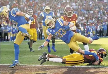  ?? AP ?? UCLA football players want some assurances from school before they decide to return for season.