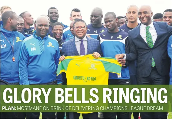  ?? Picture: Backpagepi­x ?? PRIDE OF A NATION. Minister of Sport Fikile Mbalula receives a Mamelodi Sundowns jersey from technical staff during the club’s training session at Chloorkop yesterday.