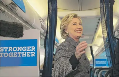  ?? | MATT ROURKE/ AP ?? Hillary Clinton on Thursday speaks to the media aboard her campaign plane at Midway Airport.