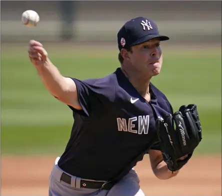  ?? GENE J. PUSKAR - THE ASSOCIATED PRESS ?? New York Yankees starting pitcher Corey Kluber delivers during the first inning of a spring training exhibition baseball game against the Detroit Tigers in Lakeland, Fla., Tuesday, March 23, 2021.