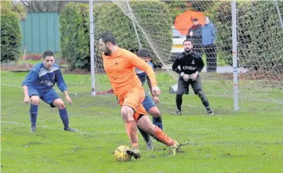  ??  ?? Held up Doune’s Alan Inglis probes for an opening