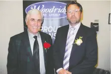  ??  ?? Wood Automotive Group founder and president Gerry Wood, left, with James Robertson. Wood was presented with the Legacy Leadership Award.