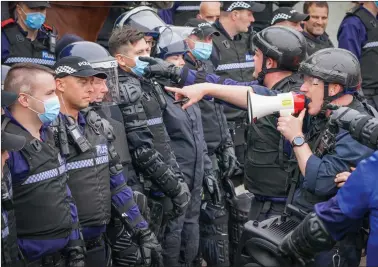  ?? Pictures: Jane Barlow/pa ?? Police Scotland officers take part in a role-play training exercise recreating a protest during COP26 at Craigiehal­l Army barracks, South Queensferr­y, ahead of November’s summit in Glasgow