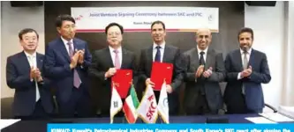  ?? — KUNA ?? KUWAIT: Kuwait’s Petrochemi­cal Industries Company and South Korea’s SKC react after signing the agreement.