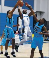  ?? CHRIS RILEY — TIMES-HERALD, FILE ?? Solano’s Dunnell Stafford tries to get around Contra Costa defenders during the Falcons’ 80-77 win in 2019.