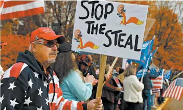  ?? PAULA BRONSTEIN/AP ?? President Trump’s supporters protest against presumptiv­e President-elect Joe Biden’s win Saturday in Salem, Oregon.